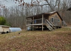 37.76+/-acres already set up for off the grid living with 2 cabins.