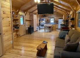 37.76+/-acres already set up for off the grid living with 2 cabins.