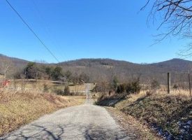 29.21+/- acres with rolling hills featuring scenic mountain and Lake views of Dale Hollow Lake