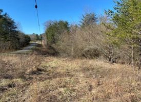 SOLD!! 5.77+/-acres Unrestricted property with a creek.