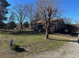 Come view this all-brick rancher nestled on 50.98+/-acres.