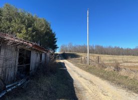 Come view this all-brick rancher nestled on 50.98+/-acres.