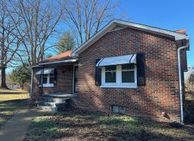Come view this all-brick rancher nestled on 50.98+/-acres.