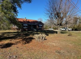 Come view this all-brick rancher nestled on 50.98+/-acres.