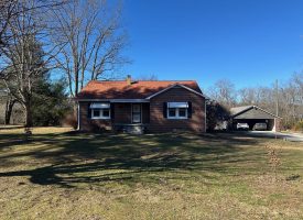 Come view this all-brick rancher nestled on 50.98+/-acres.