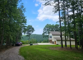 SOLD!! A one-of-a-kind property! Spectacular BLUFF property looking out to the Franklin State Forest