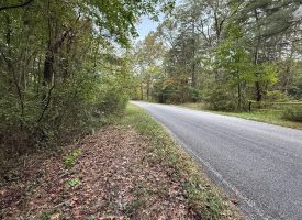 5.10+/-acres unrestricted property with Hardwoods.