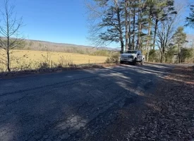 4.85+/-acres Unrestricted beautiful, wooded property.