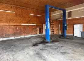 1.58+-acres with Mobile Home and Commercial Garage.