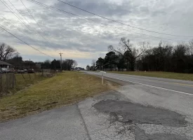 1.58+-acres with Mobile Home and Commercial Garage.