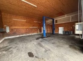 1.58+-acres with Mobile Home and Commercial Garage.