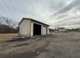 1.58+-acres with Mobile Home and Commercial Garage.