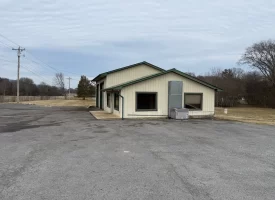 1.58+-acres with Mobile Home and Commercial Garage.