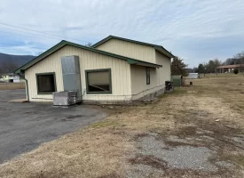 1.58+-acres with Mobile Home and Commercial Garage.
