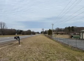 1.58+-acres with Mobile Home and Commercial Garage.