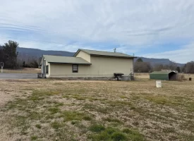 1.58+-acres with Mobile Home and Commercial Garage.