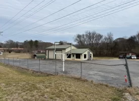 1.58+-acres with Mobile Home and Commercial Garage.